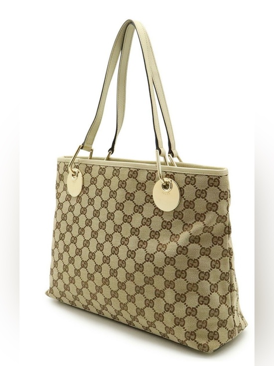 Gucci Handbags - Gucci Beige GG Canvas Tote with Gold Discs